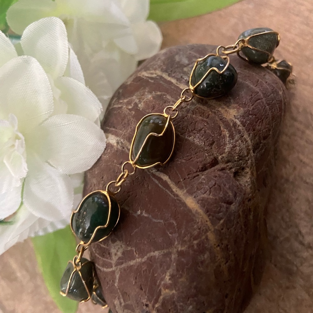 Emerald green colored rock bracelet with gold wiring
